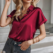 Red short sleeve blouse with relaxed fit and casual elegance, perfect for versatile styling.