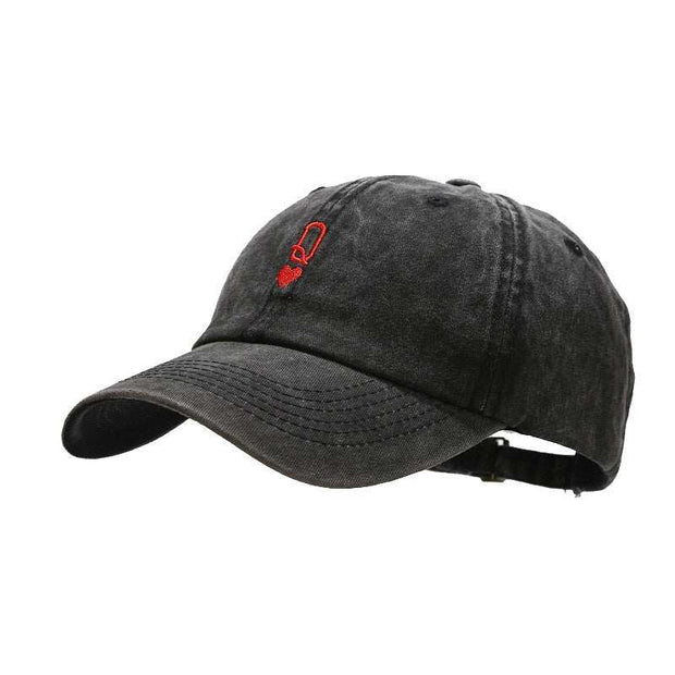 Vintage Baseball Cap with adjustable strap and washed-out black fabric.