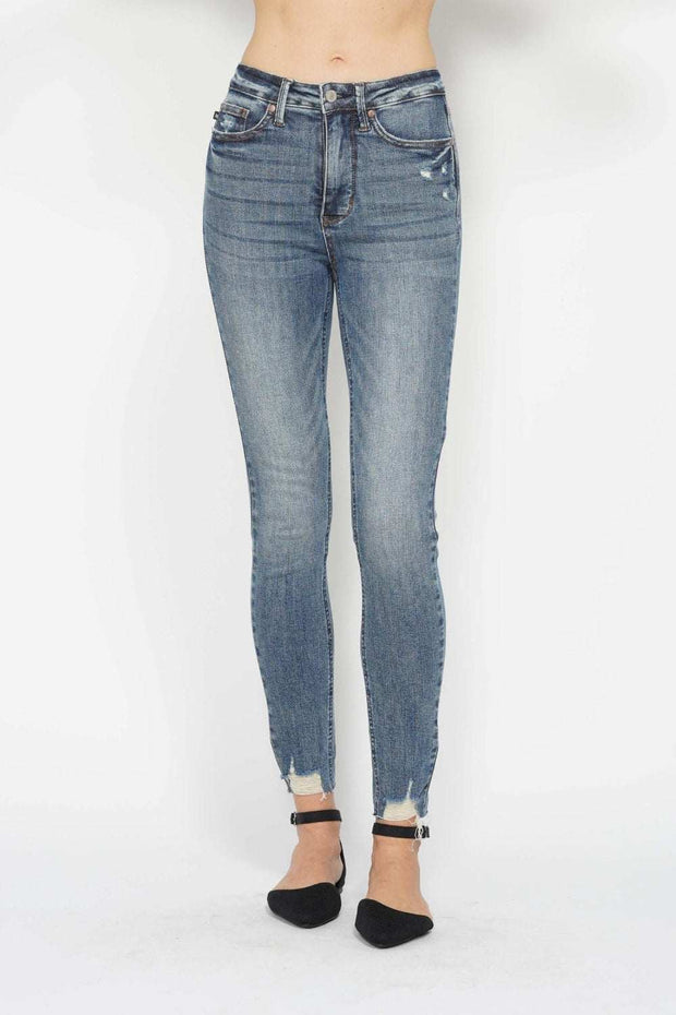 Tummy Control Vintage Skinny Jeans with distressed hem and vintage wash.