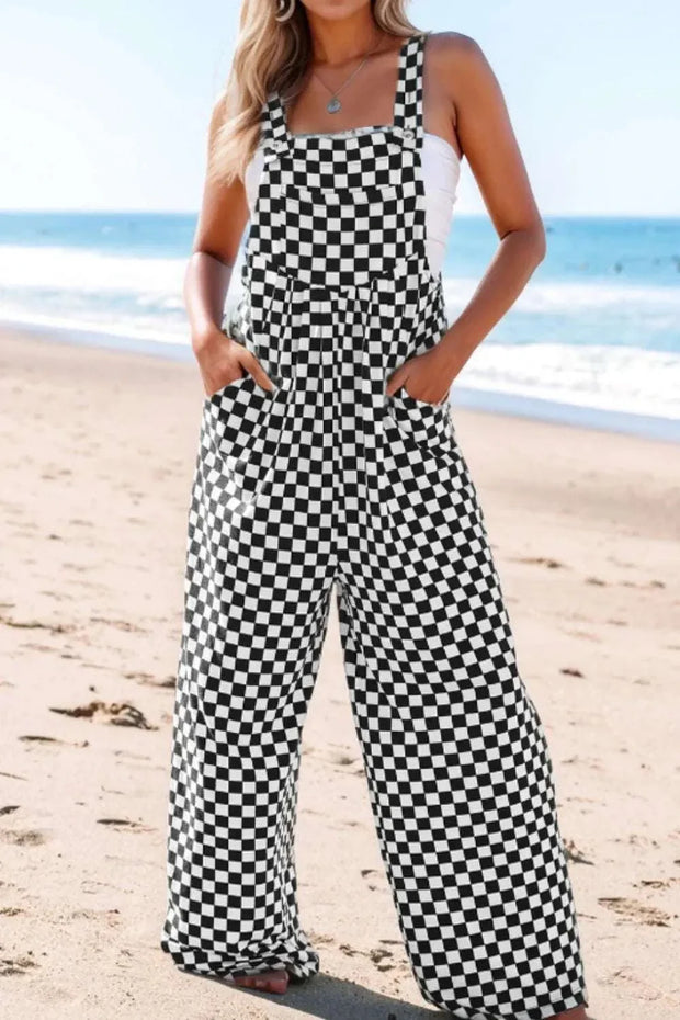 Checkered print pocketed wide leg jumpsuit on the beach.