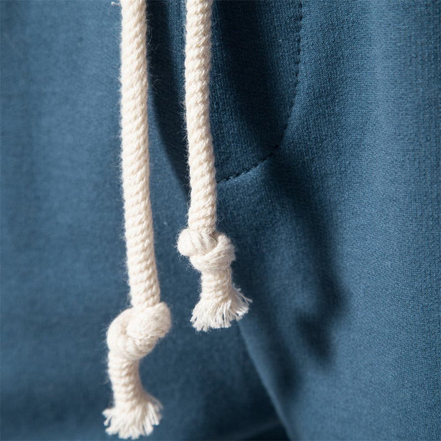 Close-up of blue Tether Shorts for Men with white drawstring detail.