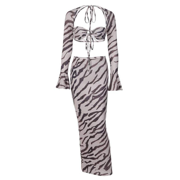 Zebra stripe printed long-sleeve slim skirt suit with matching top and flared sleeves.