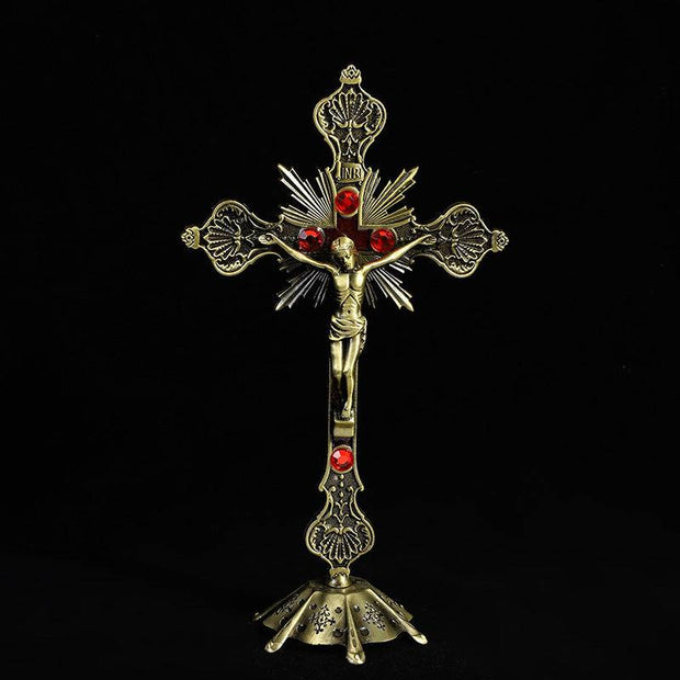 Religious Cross Ornament with intricate gold design and red accents.