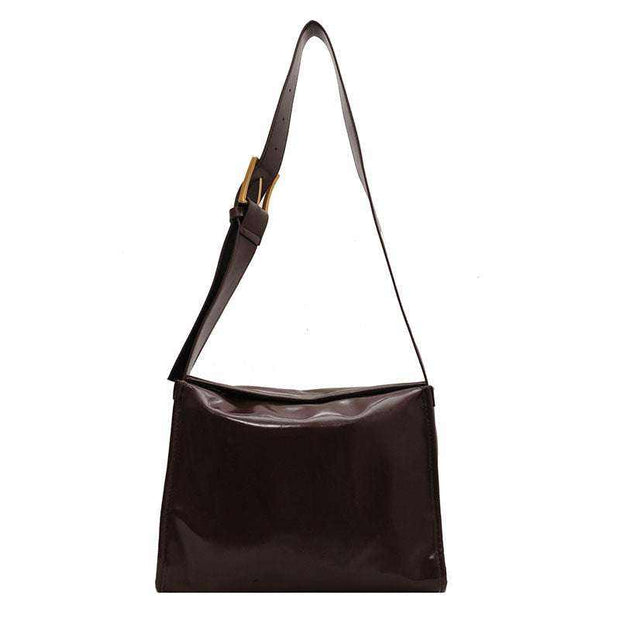 Retro Crossbody Commuter Tote with adjustable strap in brown PU material, showcasing retro style and urban simplicity.