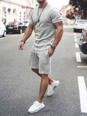 Plus size short sleeve top and shorts set in gray, featuring a classic crew neckline and elastic waistband, ideal for casual wear.
