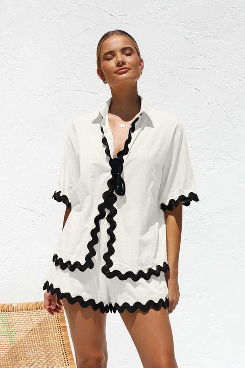 Stylish 2 Piece Summer Suit with black trim, perfect for warm weather.