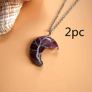 Moon Tree Of Life Necklace with silver chain and purple stone crescent pendant.