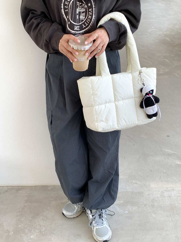 Large capacity hand bag in creamy-white with elegant design, perfect for daily use.