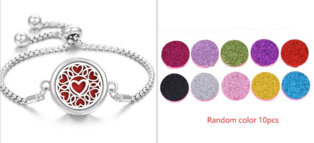 Hollow Stainless Steel Aromatherapy Bracelet with essential oil pads in various colors.