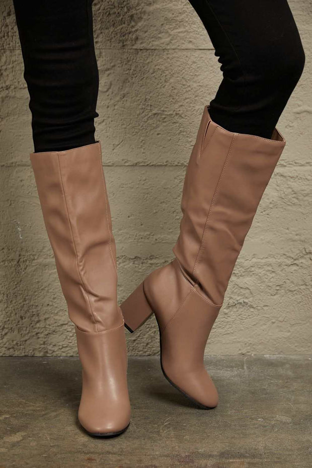 East Lion Knee High Boots in stylish beige with block heel and side zipper.