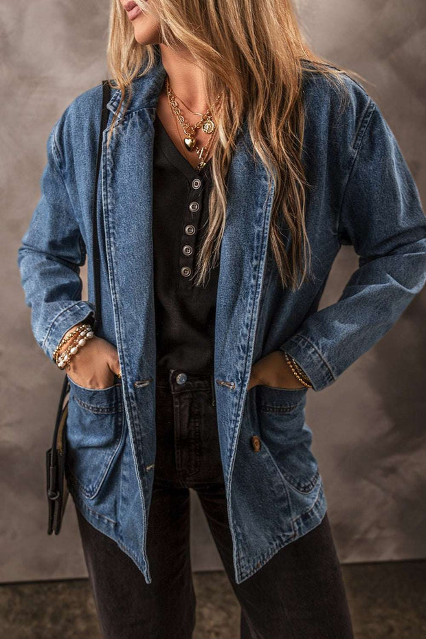 Pocketed Denim Jacket with functional pockets and classic fit, styled over black top.