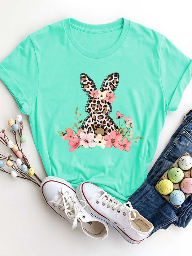 Round Neck Rabbit Tee with whimsical rabbit graphic, soft green fabric, and playful design.