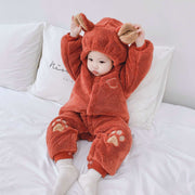 Newborn baby onesies in plush with bear ears and paw prints.