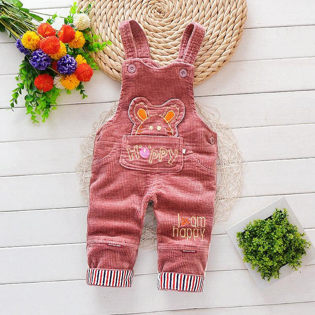 Children cartoon overalls with adjustable straps, suitable for infants, on a floral background.