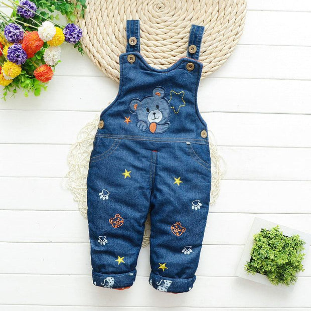 Children blue overalls with cartoon pattern, adjustable straps, and button details, ideal for active toddlers.