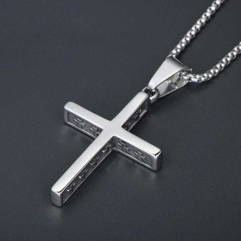 Intricate cross pendant on a religious jewelry necklace with titanium steel chain.