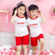 Youth Cotton Short-Sleeve Suit for kids featuring matching shirts and shorts in white and red with playful design.