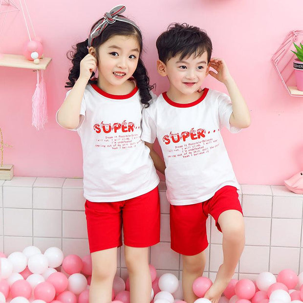 Youth Cotton Short-Sleeve Suit for kids featuring matching shirts and shorts in white and red with playful design.