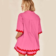 Pink 2 Piece Summer Suit with red trim, ideal for warm weather occasions.