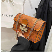 Chain shoulder bag with chic design and gold chain strap.