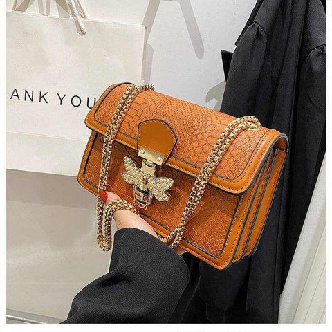 Chain shoulder bag with chic design and gold chain strap.