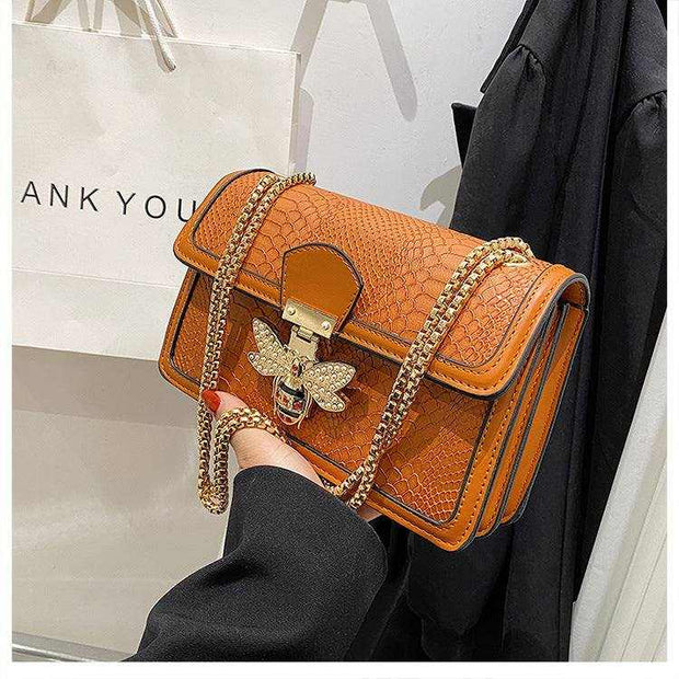 Chain shoulder bag with chic design and gold chain strap.