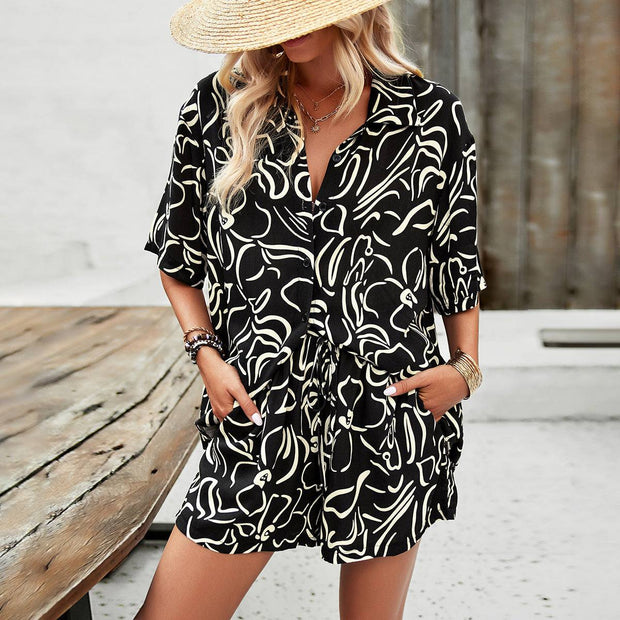 Vibrant printed shirt and drawstring shorts set in black and white, ideal for casual outings.