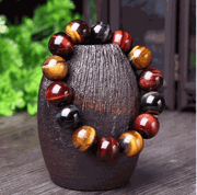 Tiger Eye Bracelet with natural crystal stones and polished beads on display.