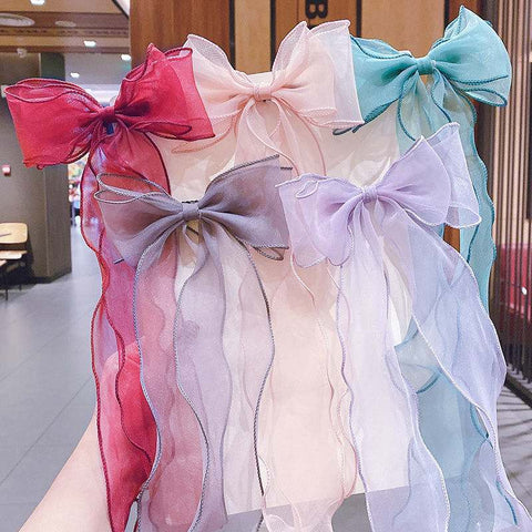 Children's bow hairpins in vibrant colors and Korean style, perfect for securing hair with charm and comfort.