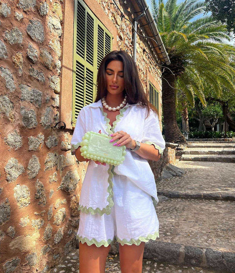 Stylish 2 Piece Summer Suit in white with green trim, perfect for warm weather outings.