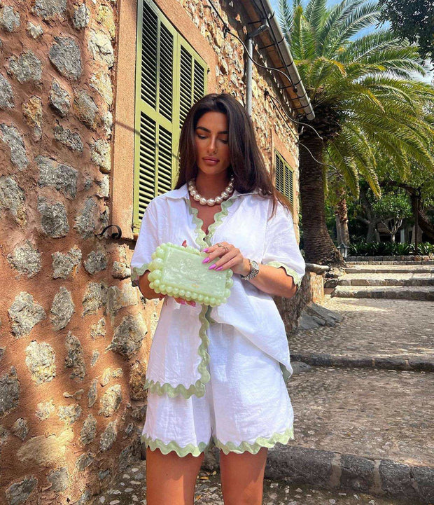 Stylish 2 Piece Summer Suit in white with green trim, perfect for warm weather outings.