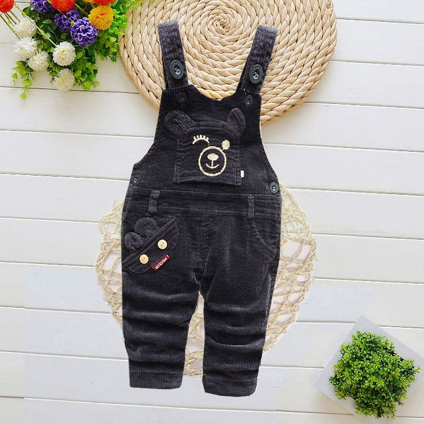 Children overalls with adjustable straps and cartoon pattern, ideal for winter wear.