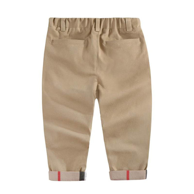 Boys casual cotton trousers with elastic waistband and adjustable drawstrings in beige color.