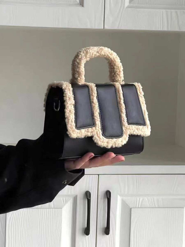 Lambs Wool Crossbody Bag in black with cozy handle and trim.