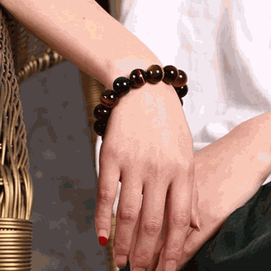 Tiger Eye Bracelet with natural stones and polished beads on wrist.