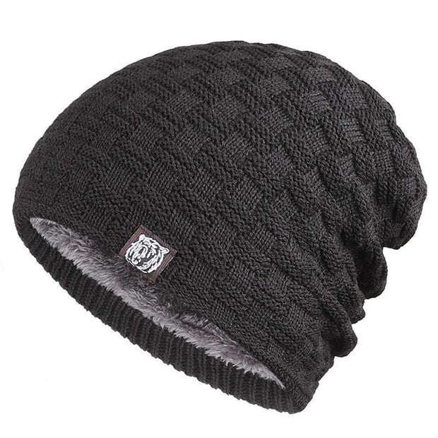 Black Tiger Label Fleece Hat with unique branding detail, providing warmth and comfort for outdoor adventures.