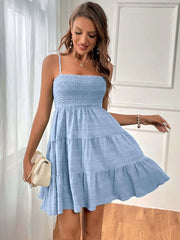 Square-collar pleated summer dress in light blue with spaghetti straps, perfect for a chic summer look.