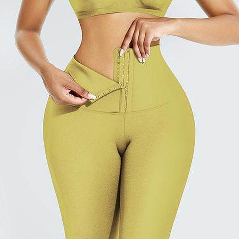 Abdominal Hip Lift Yoga Pants in light yellow with high-waisted compression design for support and shaping.