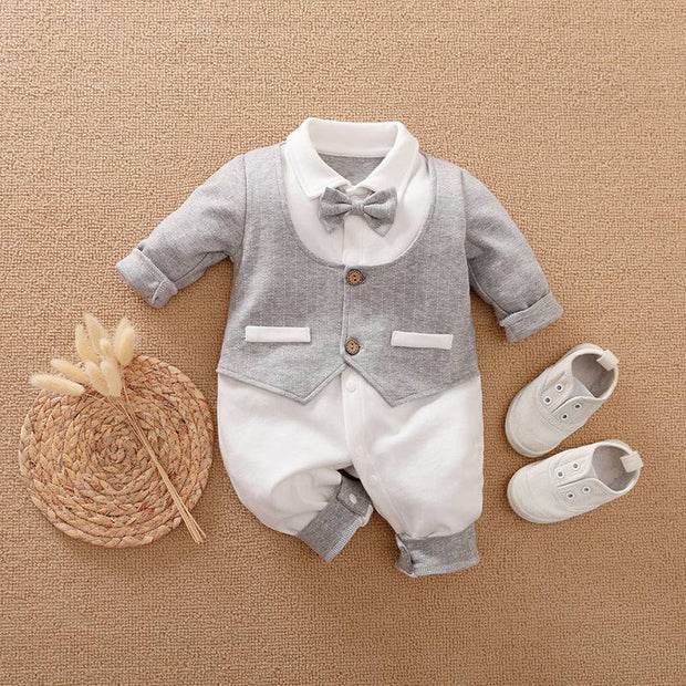 Baby Gentleman Jumpsuit with bowtie and faux vest, paired with baby shoes, showcasing elegant style for infants.