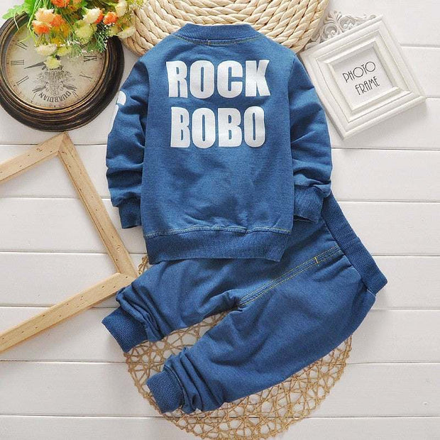 Boys denim suit featuring a stylish denim jacket and matching pants, perfect for young trendsetters.