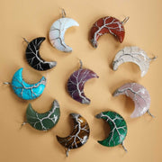 Colorful Moon Tree pendants in a crescent shape with crystal accents.