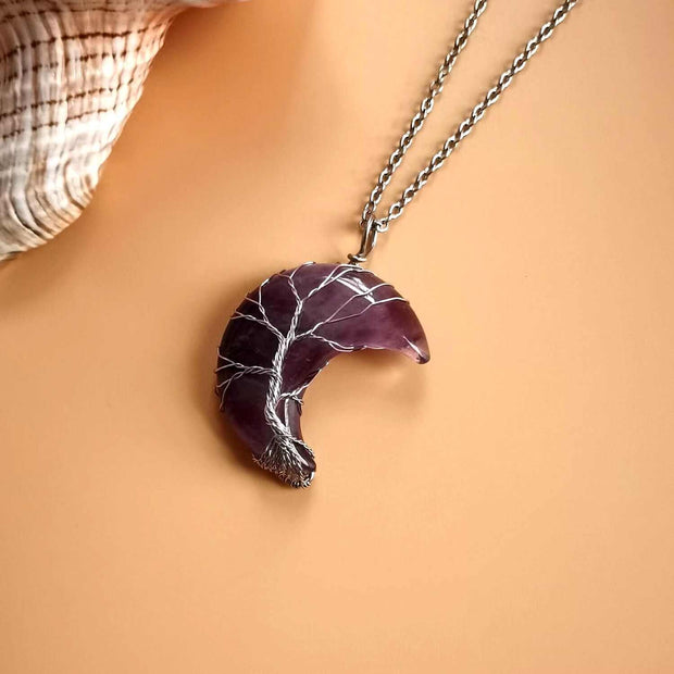 Moon Tree Of Life Necklace with purple crescent moon pendant and tree design.