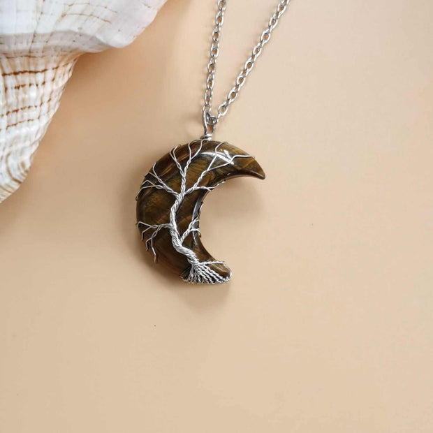 Moon Tree of Life Necklace with crescent moon and tree design, crafted from natural stone on a water wave chain.