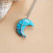 Moon Tree Of Life Necklace with a crescent pendant, featuring artistic tree design and celestial motifs.