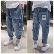 Big Kids Loose Harem Overalls with adjustable straps, relaxed fit, and roomy pockets in trendy denim style.