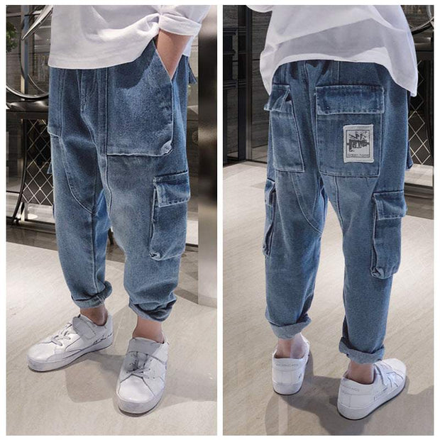 Big Kids Loose Harem Overalls with adjustable straps, relaxed fit, and roomy pockets in trendy denim style.