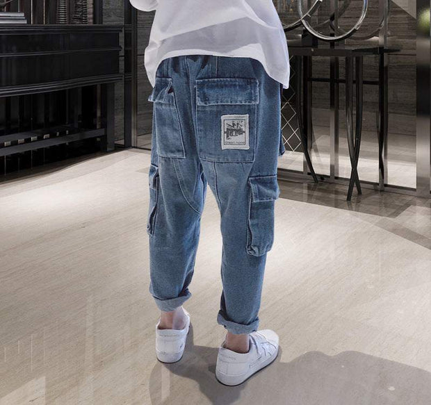 Big Kids Loose Harem Overalls with relaxed fit and pockets, suitable for active children.