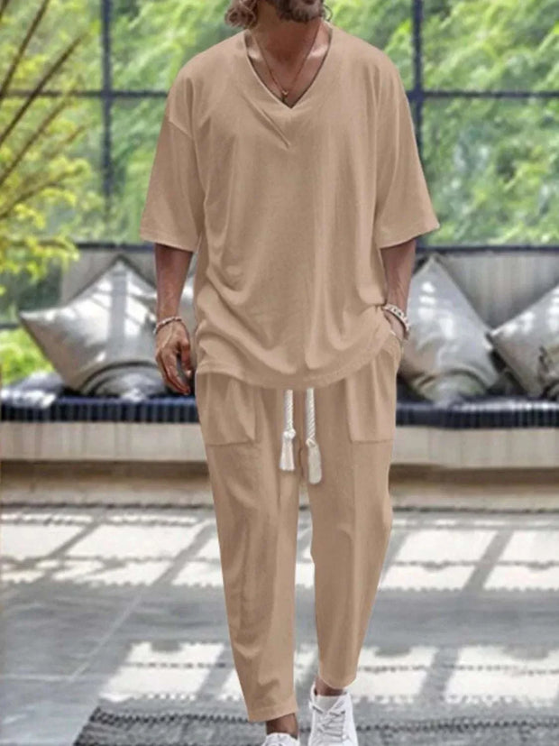 Men's V-Neck Half Sleeve Top and Pants Set in neutral tone, showcasing a relaxed fit and sleek silhouette, suitable for casual or semi-formal occasions.