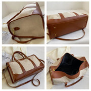 Large Capacity Purse with brown leather trim and spacious interior pockets.