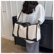 Large Capacity Purse with black accents and shoulder strap, perfect for stylish organization.